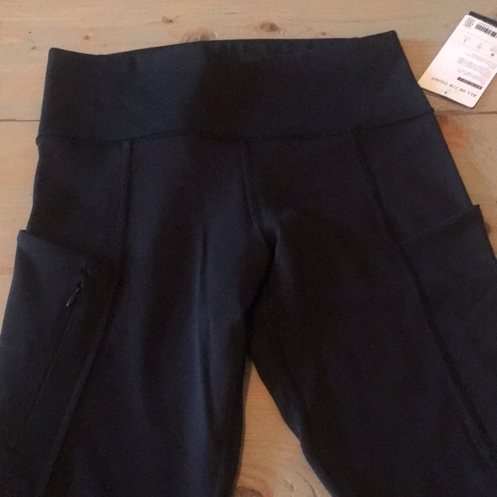 New athlete “all in 7/8 tights”. Side pockets!